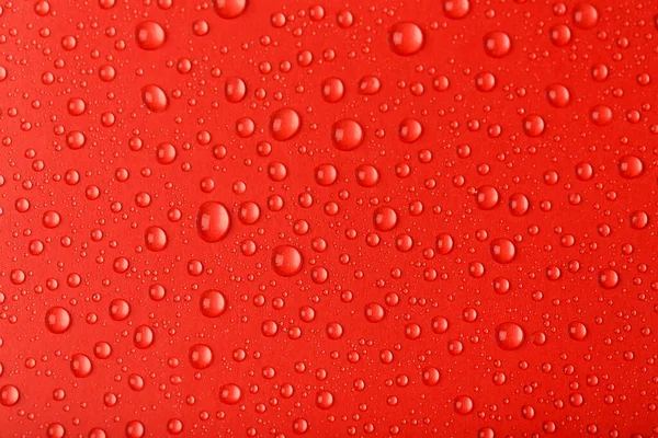 Gotas Agua Sobre Fondo Rojo —  Fotos de Stock