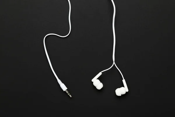 Auriculares Blancos Sobre Fondo Negro —  Fotos de Stock