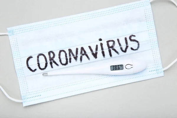 Mask Text Coronavirus Thermometer Grey Background — Stock Photo, Image