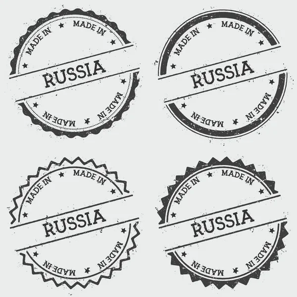 Gemaakt in Rusland insignia stempel geïsoleerd op een witte achtergrond Grunge ronde hipster zegel met inkt van de tekst — Stockvector