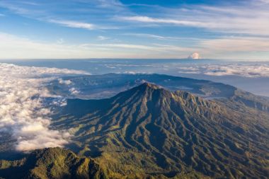 Aerial view at Caldera Batur from Agung volcano summit at Bali island in Indonesia clipart