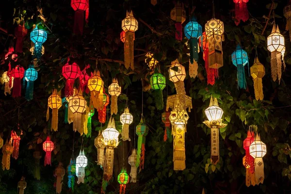 Colourful lantern light on sacred Bodhi tree during thai lantern festival Beginning of Loy Krathong