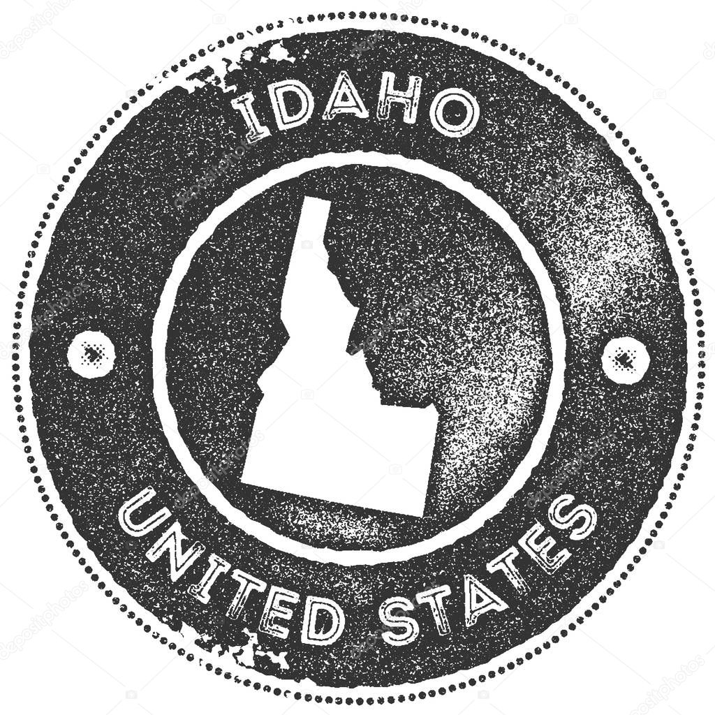 Idaho map vintage stamp. Retro style handmade label, badge or element for travel souvenirs. Dark grey rubber stamp with us state map silhouette. Vector illustration.