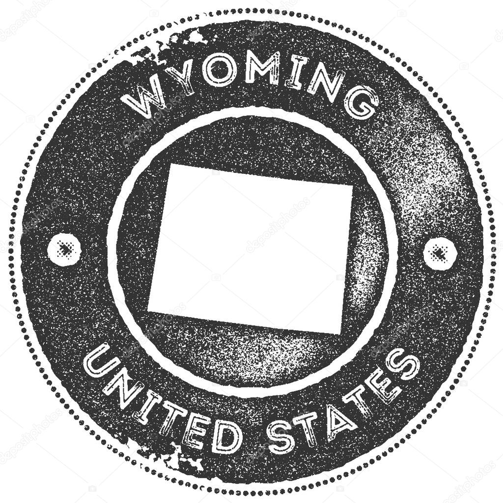 Wyoming map vintage stamp. Retro style handmade label, badge or element for travel souvenirs. Dark grey rubber stamp with us state map silhouette. Vector illustration.