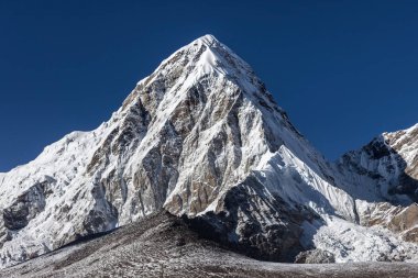 Pumori mountain summit on the famous Everest Base Camp trek in Himalayas Nepal Glamorous photo