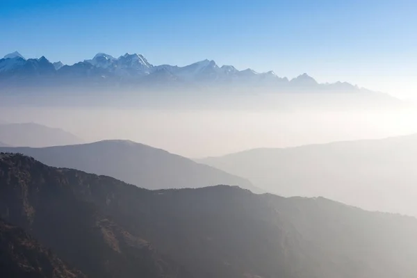 Misty landscape in himalayas Foggy mountain shapes Beautiful view on everest base camp track