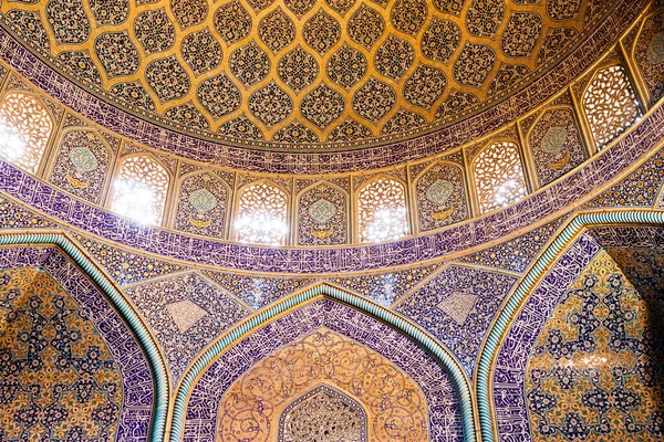 Islamic geometric pattern in Mosque. Islamic arabesque ornament on a mosque walls and ceiling in Iran.