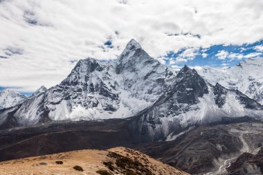 Beautiful view of Ama Dablam mountain summit on the famous Everest Base Camp trek in Himalayas, Nepal. Elegant photo.