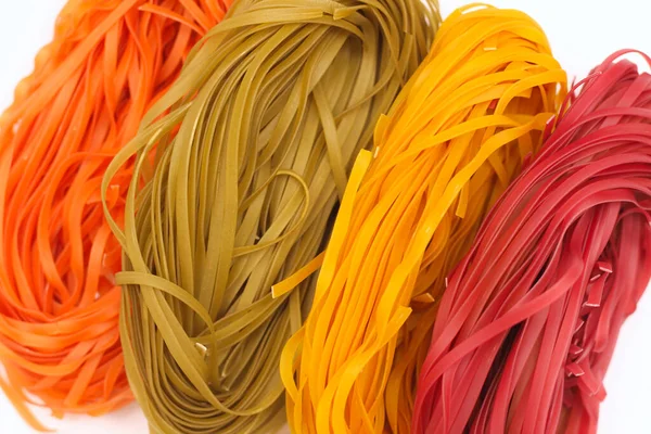 Isolated colored spaghetti nests on a white background. — 스톡 사진