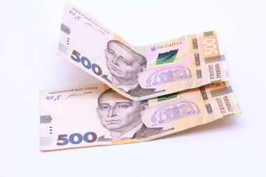 Two new banknotes in denominations of 500 Ukrainian hryvnias isolated on a white background with shadow. European money exchange. Ukraine currency