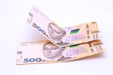 Two new banknotes in denominations of 500 Ukrainian hryvnias isolated on a white background with shadow. European money exchange. Ukraine currency
