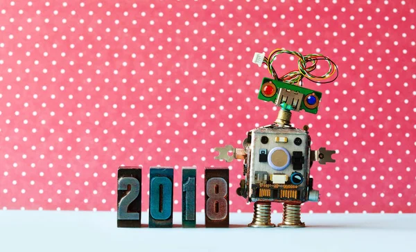 Friendly robot 2018 letterpres digits, red dot background pattern. Creative design new year xmas poster.