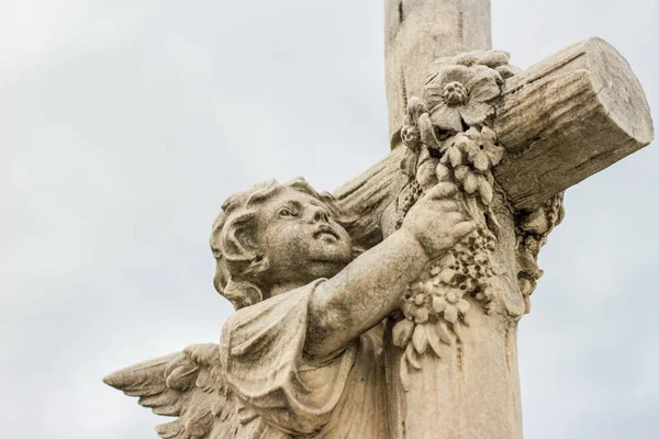 Angel and Cross sculpted statue — Stock Photo, Image