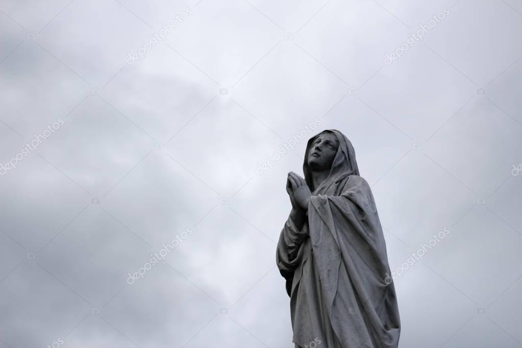 Virgin Mary stone statue