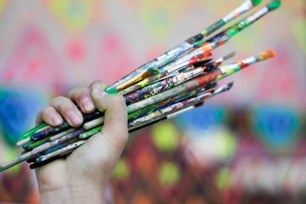 Human hand holding art brushes — Stock Photo, Image