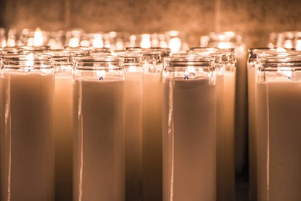 Algunas velas de cera encendidas — Foto de Stock