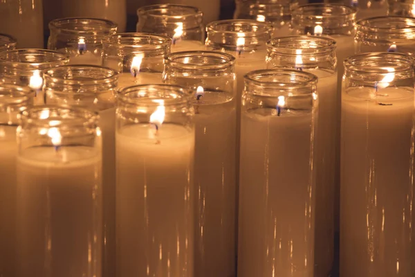 Algumas velas de cera acesas — Fotografia de Stock