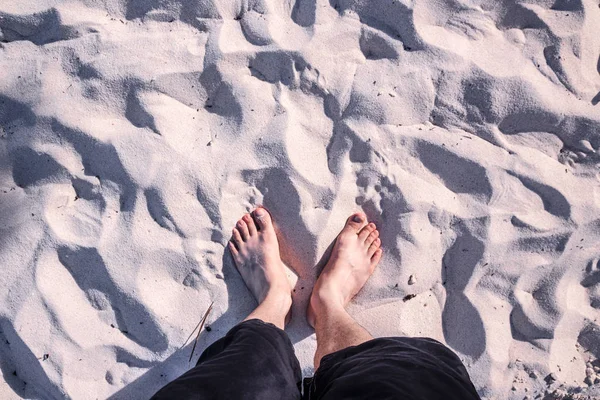 Human feet on beach sand — Stock Photo, Image