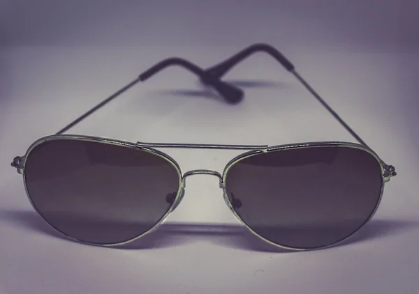 Solglasögon i lightbox photograsph — Stockfoto