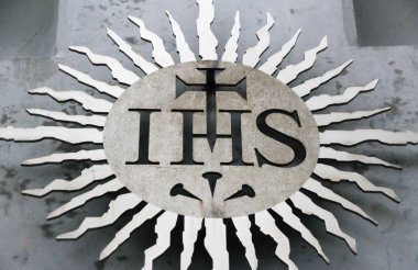 MONTERREY, NUEVO LEN, MEXICO - 4.8.2018: (Photograph of a Jesuit religious symbol at Corpus Christi Parish) clipart