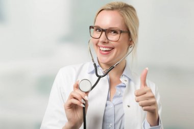 young female doctor with stethoscope clipart