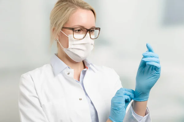 Female doctor with medical gloves — Stock Photo, Image