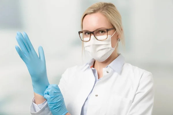 Doctor Puts Medical Gloves — Stock Photo, Image