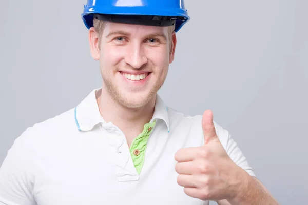 Young Engineer Blue Hard Hat Shows Thumbs — Stock Photo, Image