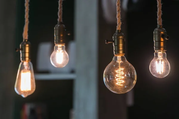 Vintage incandescent Edison type bulbs and window reflections — Stock Photo, Image