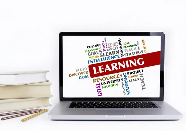 Learning - word cloud, education concept. Laptop and books isola