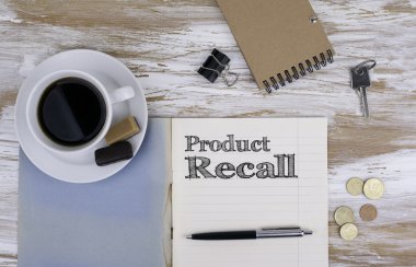 Product Recall - Copybook on the desktop clipart