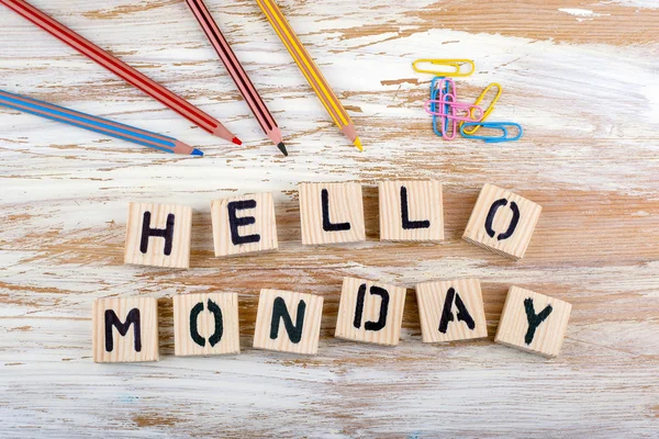 Text: Hello Monday from wooden letterson on wooden background