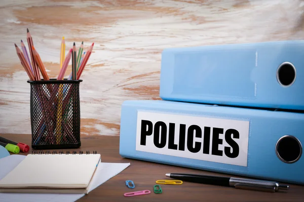 Policies, Office Binder on Wooden Desk. On the table colored pen — Stock Photo, Image