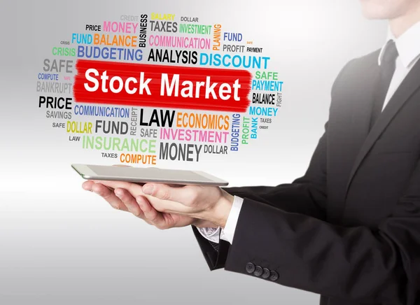 Stock Market Concept, giovane con in mano un tablet — Foto Stock