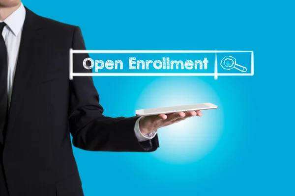 Open Enrollment, young man holding a tablet computer — Stock Photo, Image