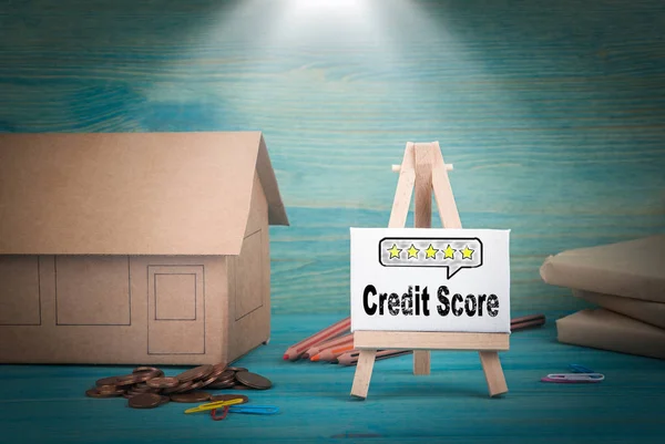 credit score. home model, money and a notice board under the sunlit
