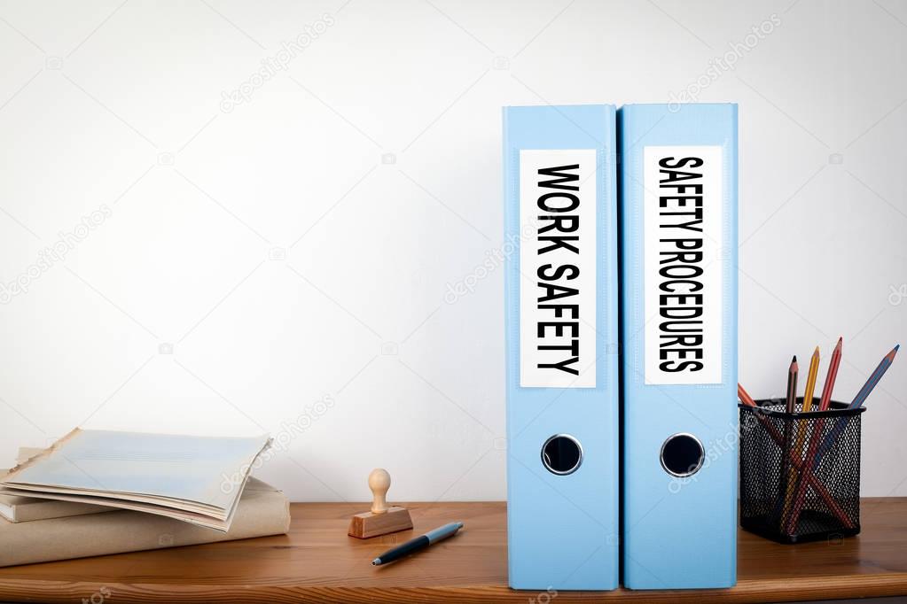 Work Safety and Safety Procedures binders in the office. Station