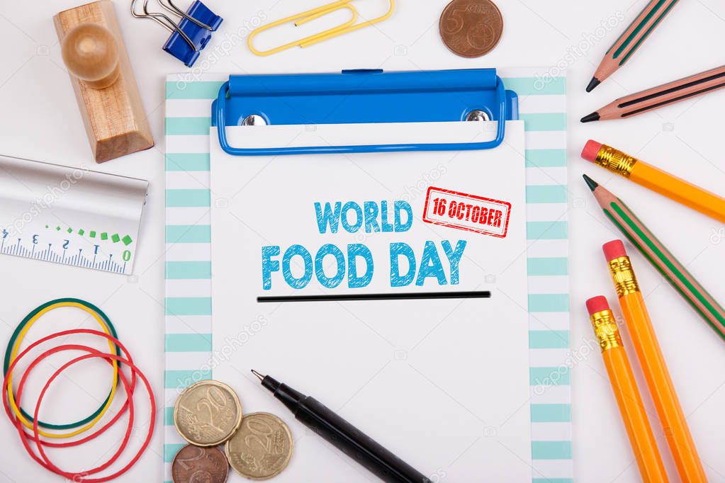 World Food Day 16 october. Office desk with stationery and mobile phone