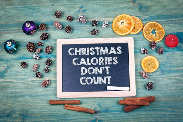 Christmas Calories Dont Count. Holiday background. Ornaments and decor on a wooden table