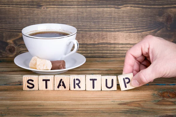 Startup. Wooden letters on the office desk, informative and communication background — Stock Photo, Image