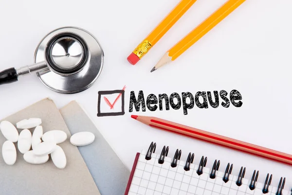 Menopausia. Cuestionario con cruz roja sobre el papel blanco — Foto de Stock