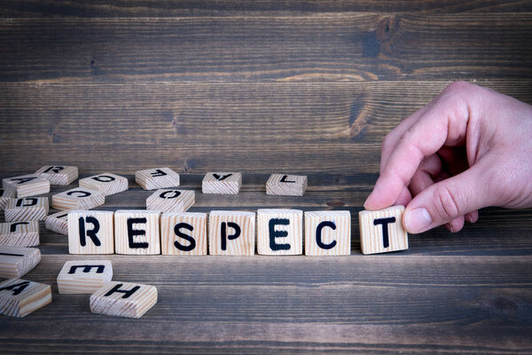 Respect. Wooden letters on the office desk