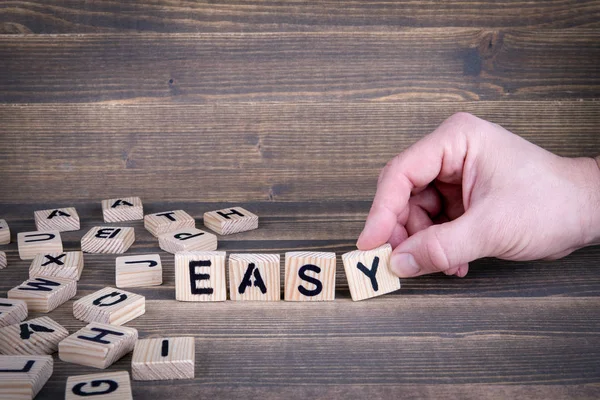 Easy. Wooden letters on the office desk — Stock Photo, Image