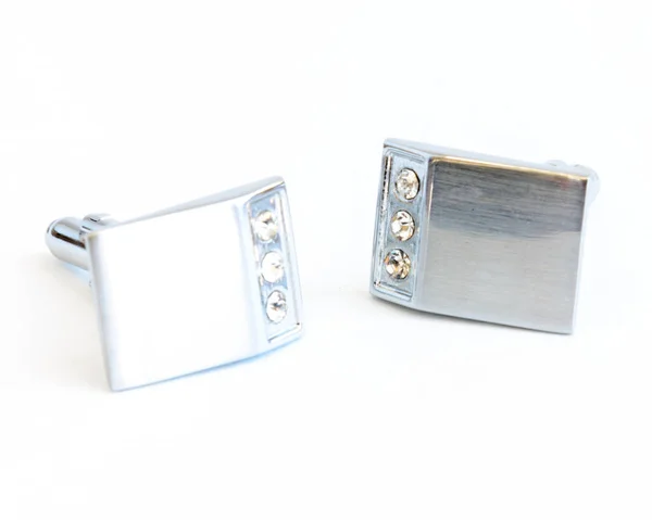 Studio shot pair of modern stainless steel cufflinks isolated on white — Stock Photo, Image