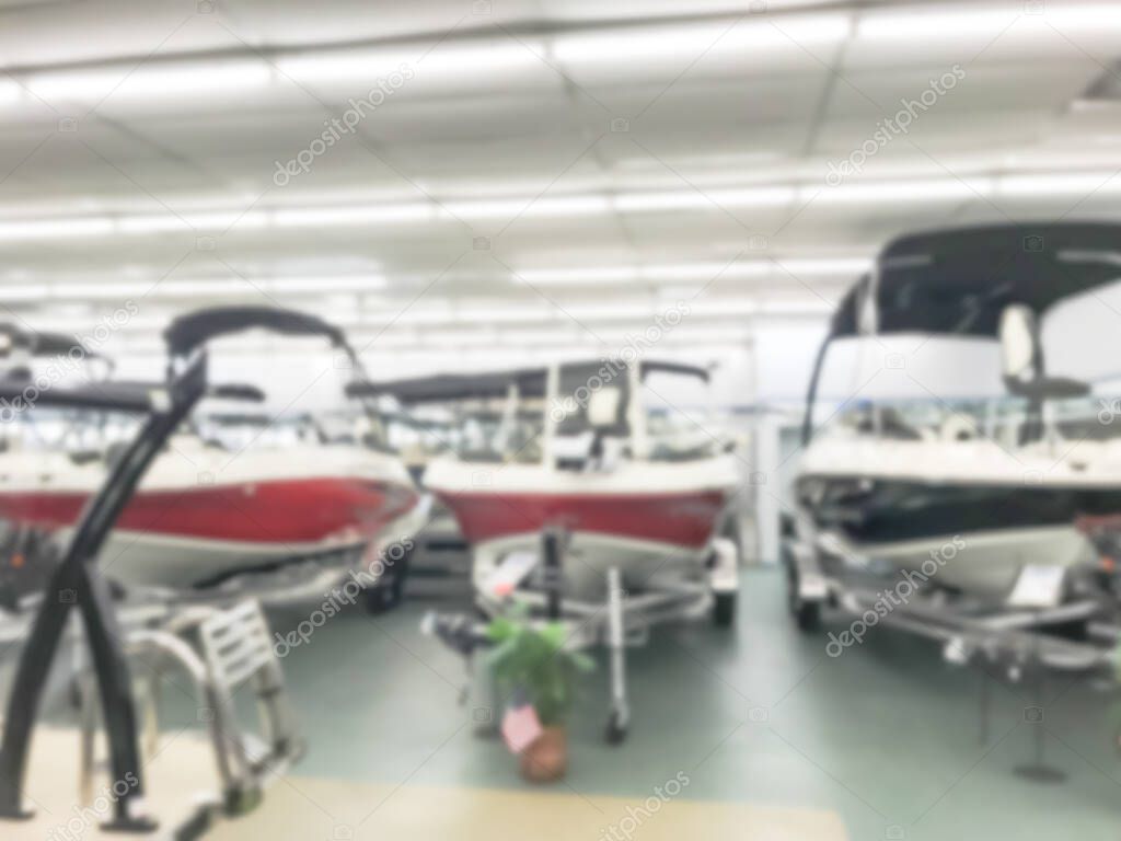 Blurry background large boat showroom dealer store in Texas, America