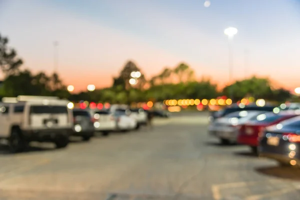 Blurry background outdoor parking lots of shopping mall in Houston, Texas at sunset