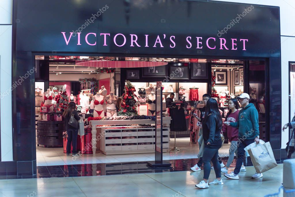GRAPEVINE, TX, US-NOV 29, 2019: Customer walking and waiting at entrance of Victoria Secret store at Grapevine Mills shopping mall. Manufacturer, marketer of lingerie, womenswear, beauty products