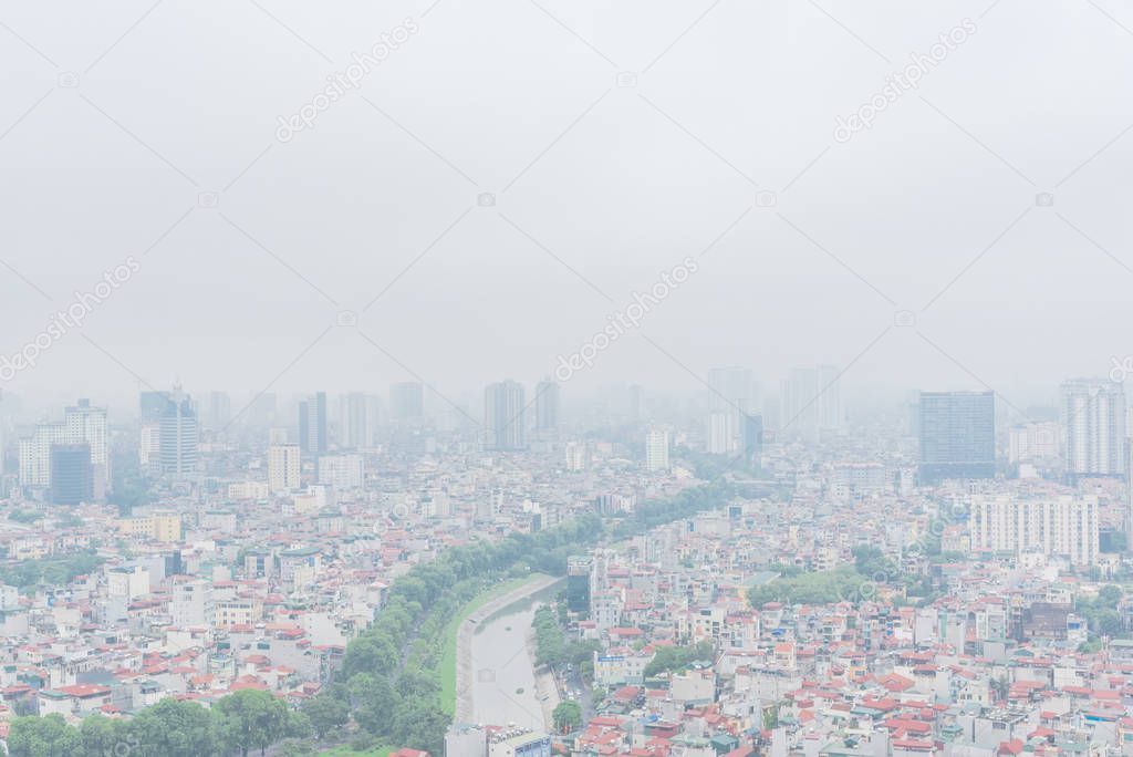 Top view high-density housing along To Lich River in Hanoi, Vietnam foggy day