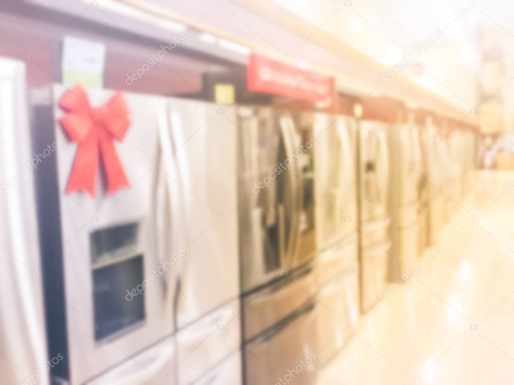 Vintage tone blurred retail store rows of home appliances equipments. Defocused brand new selection of French door refrigerators with ice makers. Row of stainless steel fridges at Irving, Texas, USA