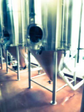 Vintage sesi bulanık görüntü Dallas, Teksas yakınlarındaki yerel restoran tam bir çalışma bira hops. Standart bira stilleri ve mevsimlik bira fermente parlak tankları Satır